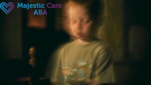 A boy with autism, shown in blurred focus to reflect visual sensory issues, looks downward as if capturing fast motion within stillness.