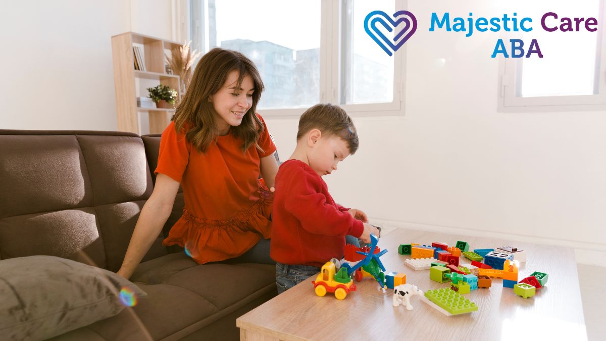 A mother joyfully guides her child playing with sensory items and puzzle pieces in a bright, inviting living room during in-home ABA therapy.