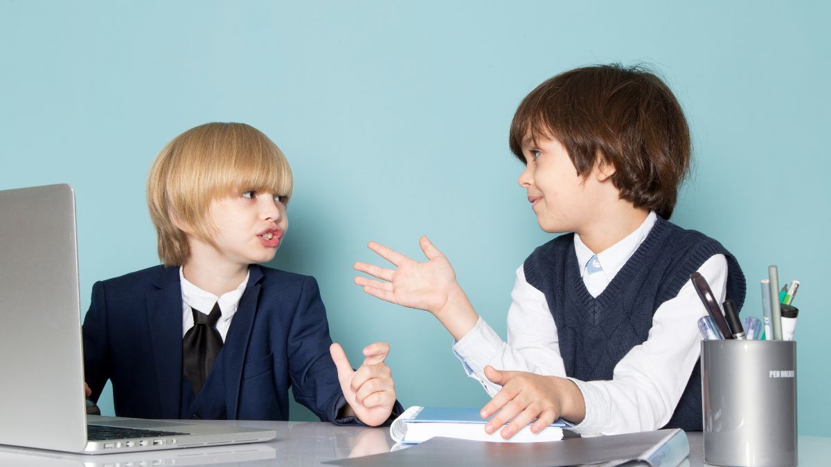 Children engaging in ABA therapy, practicing social skills through friendly conversation and positive interaction.