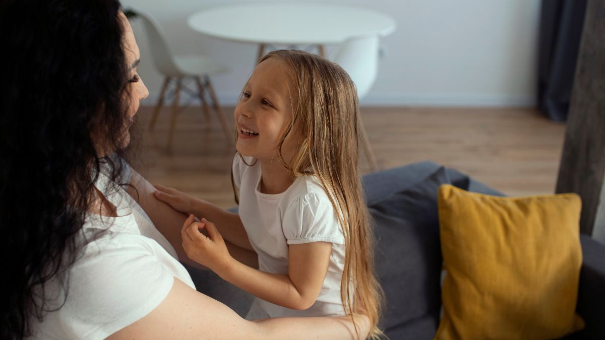 Child receiving in-home ABA therapy, guided by a parent during a learning activity.