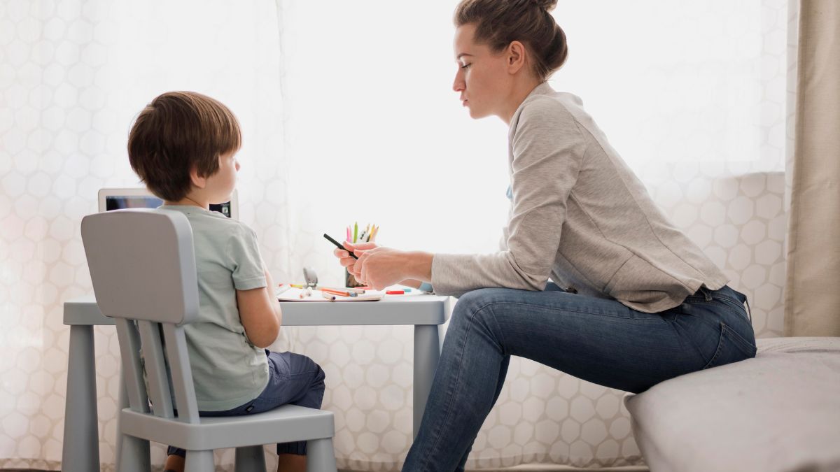 Child participating in an initial ABA assessment while receiving structured guidance from a therapist.
